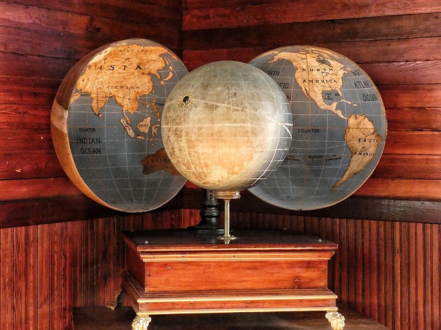 stack of translated novels with world map