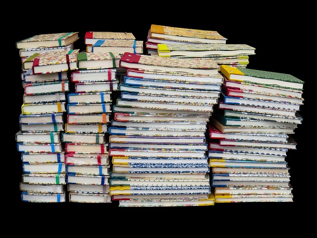 stack of spring book releases with tulips